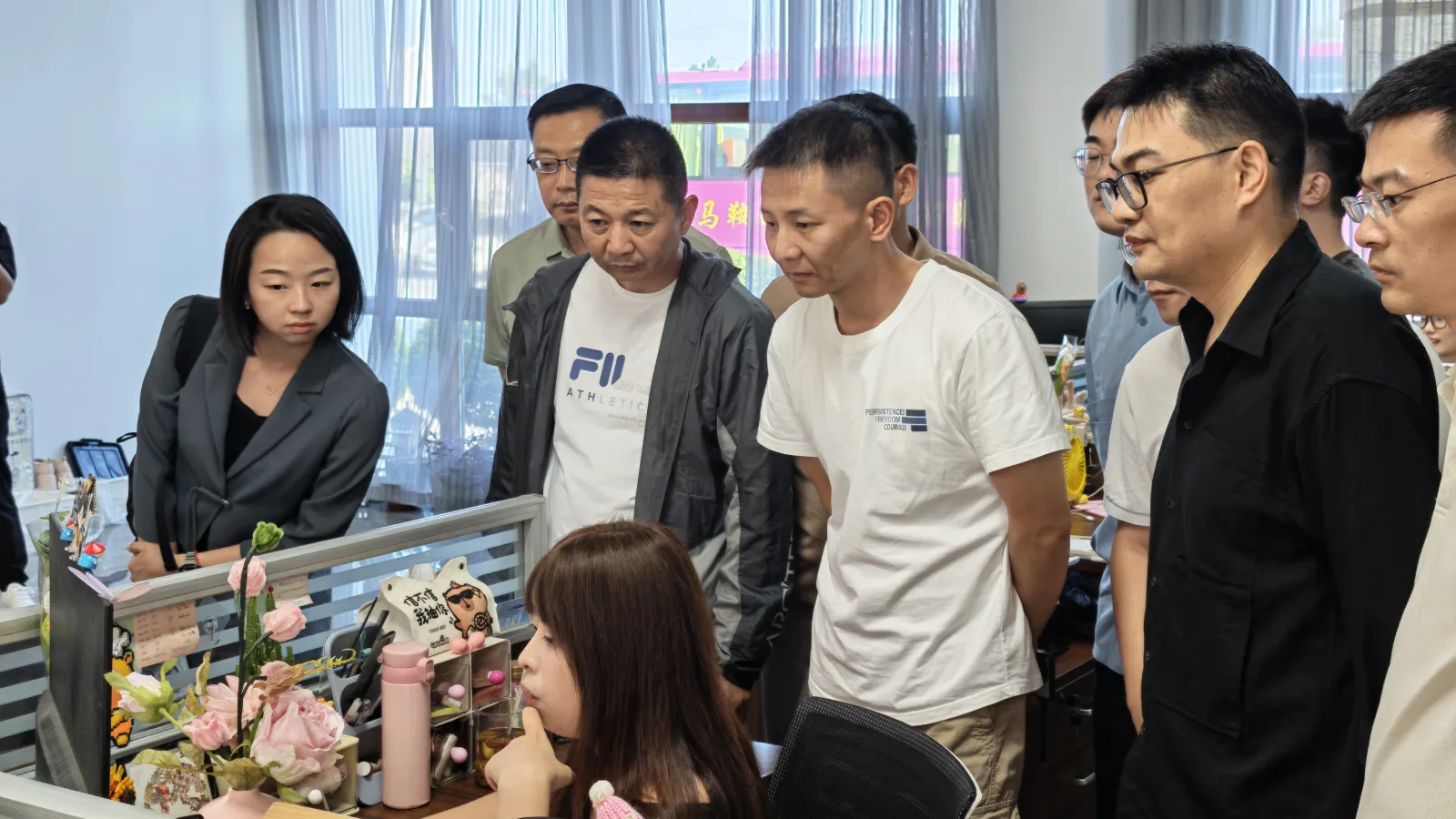 Visitors in the LYNCCN office during the AI class tour